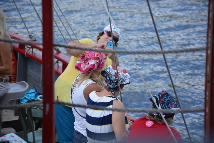 a person riding on the back of a boat