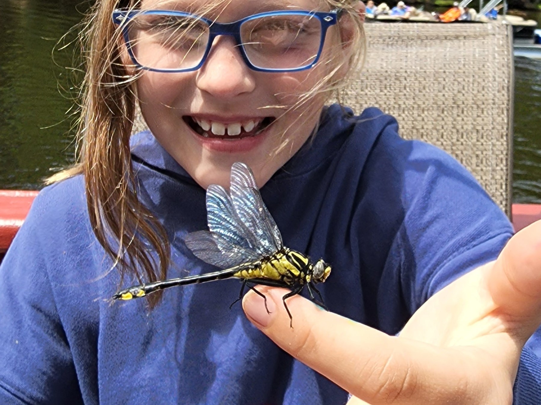 a woman wearing sunglasses taking a selfie