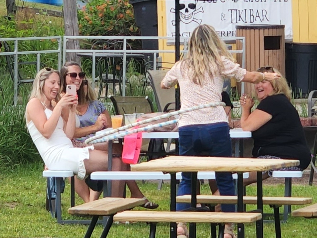 a woman sitting at a picnic table