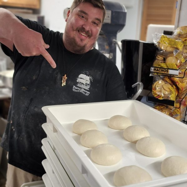 a man cooking food in a kitchen