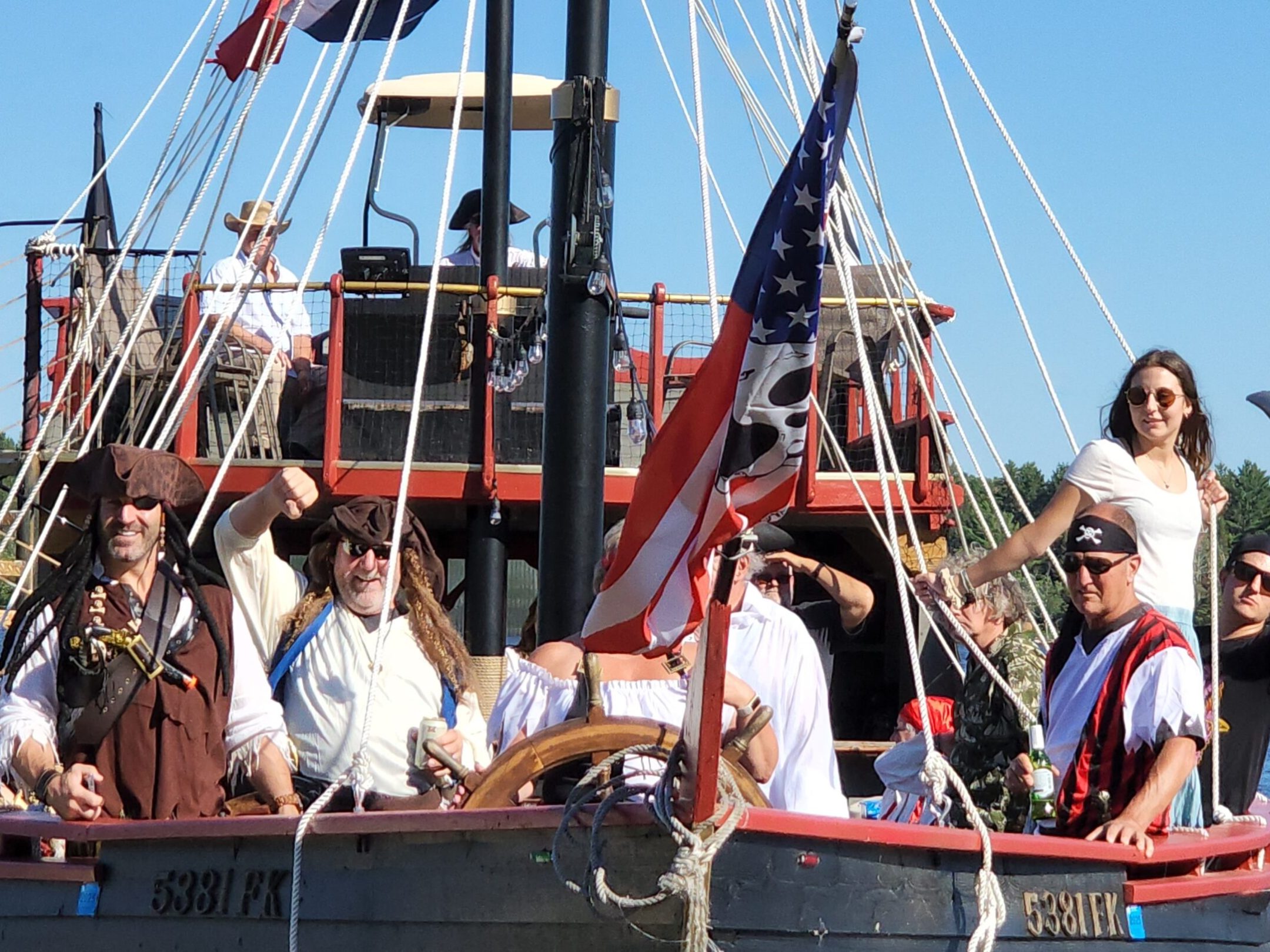 a group of people riding on the back of a boat