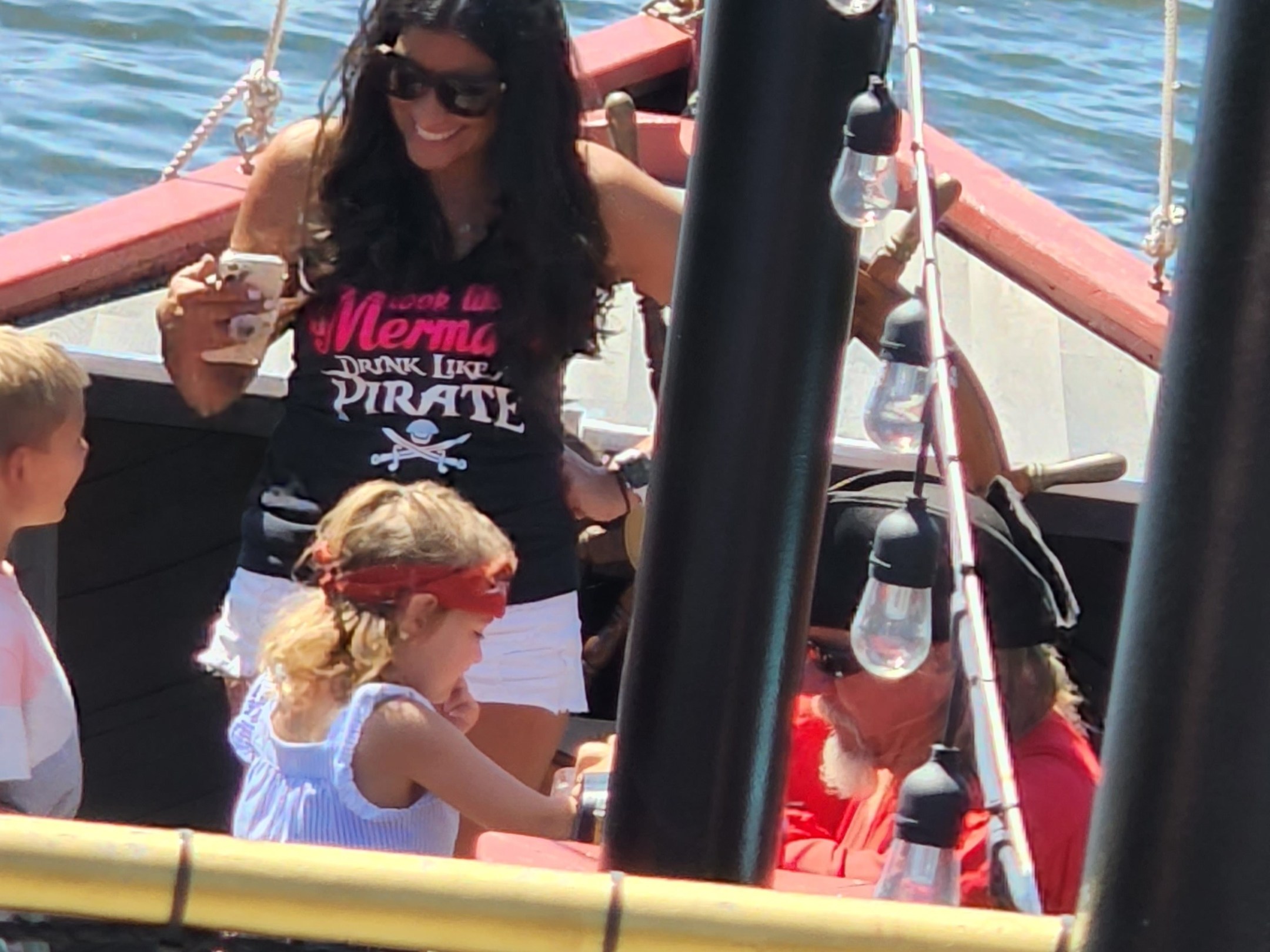 a group of people on a boat in the water
