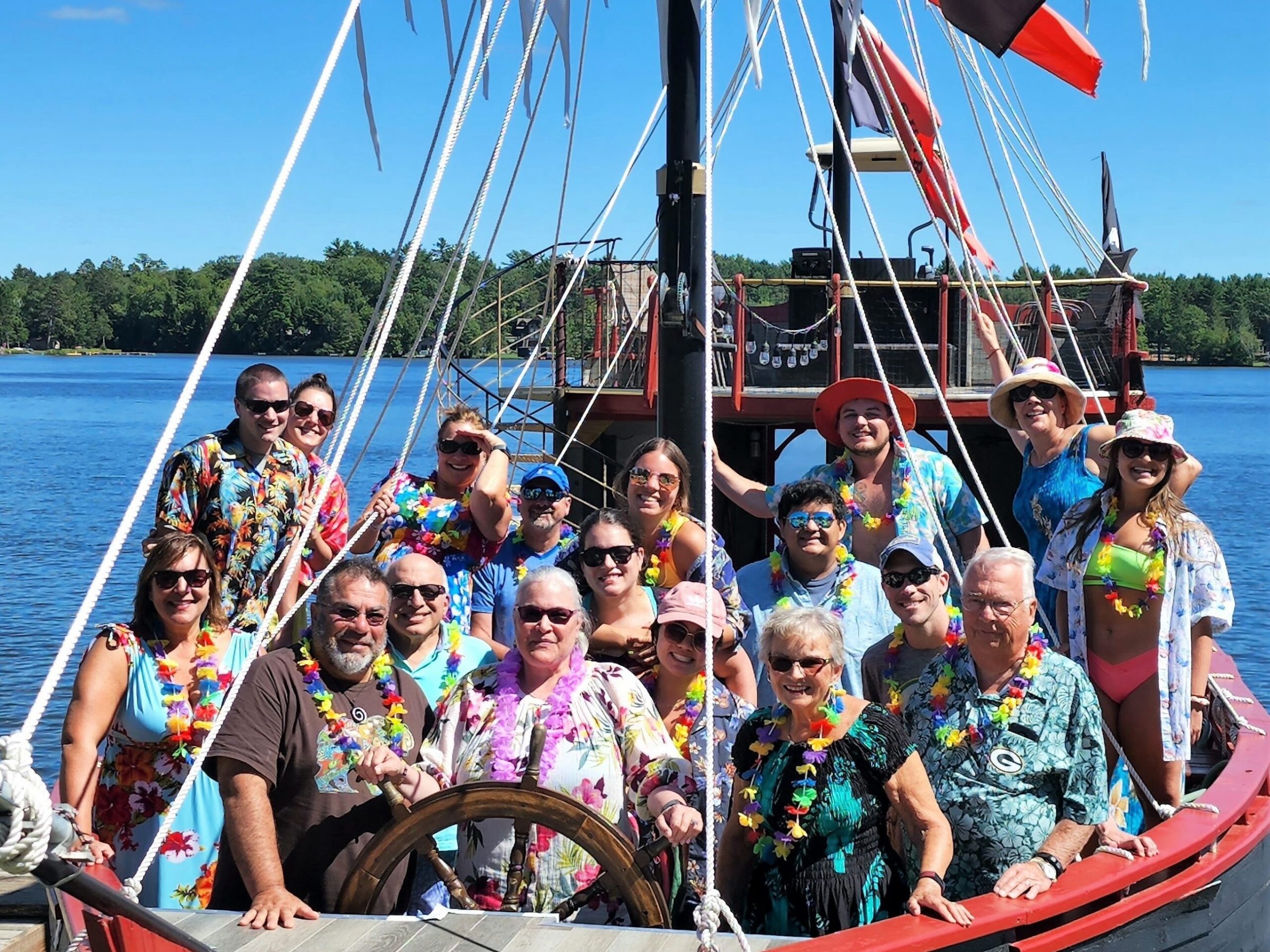 a group of people on a boat in a large body of water