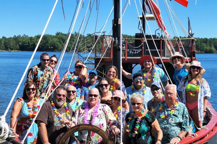 a group of people on a boat in a large body of water