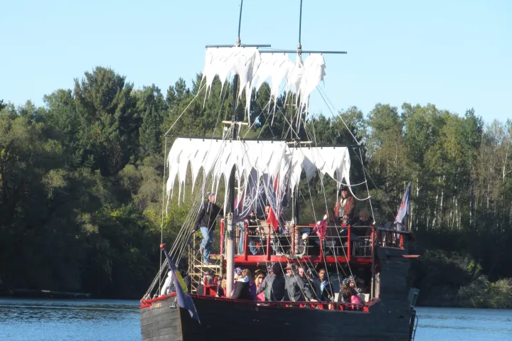 a group of people on a boat in the water