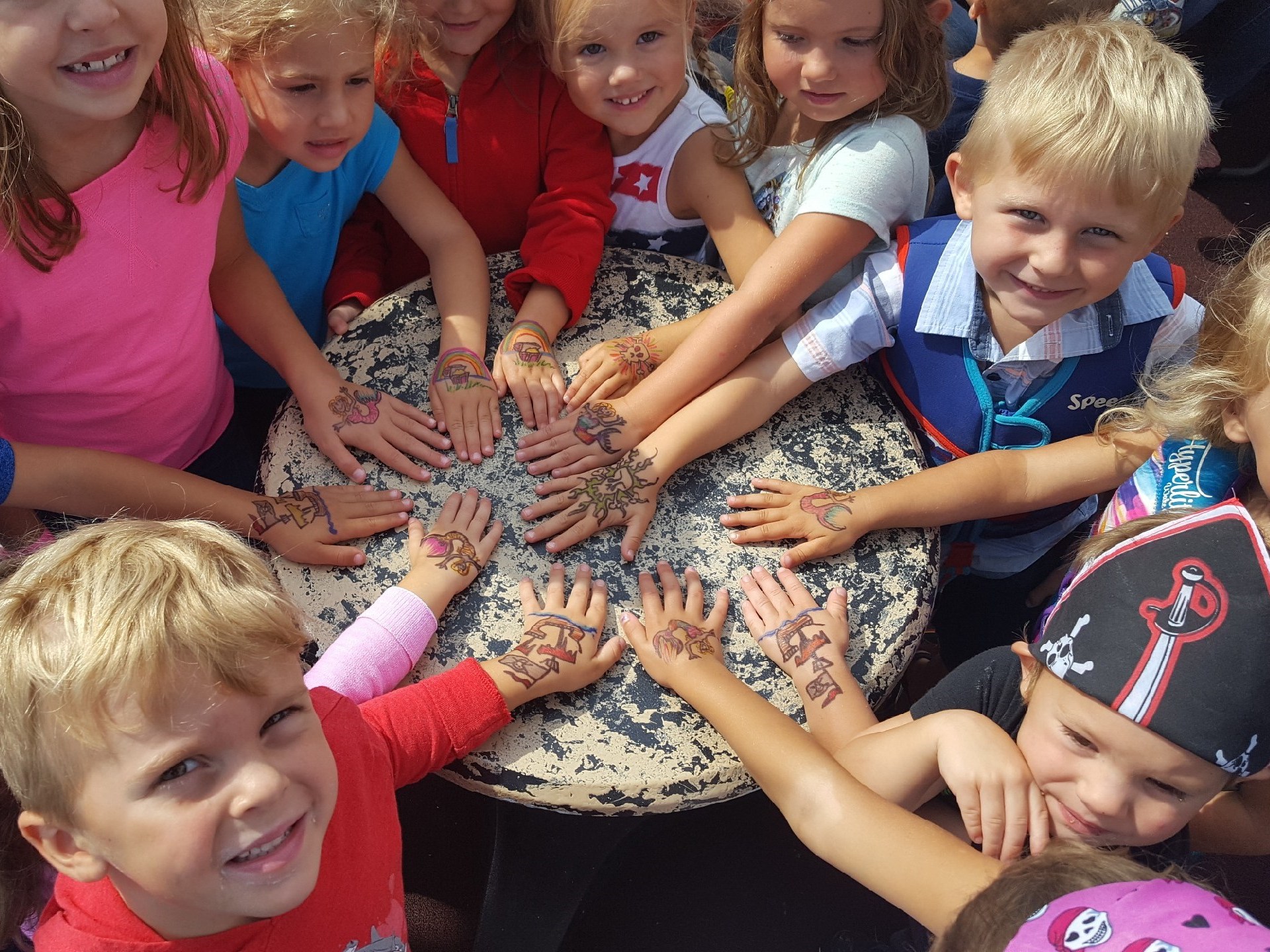 a little girl holding a baby