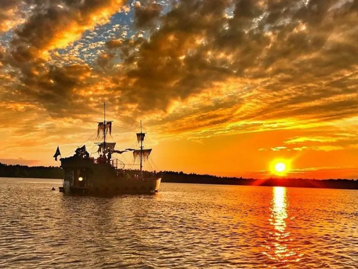 a close up of a boat next to a body of water