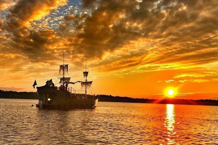 a close up of a boat next to a body of water