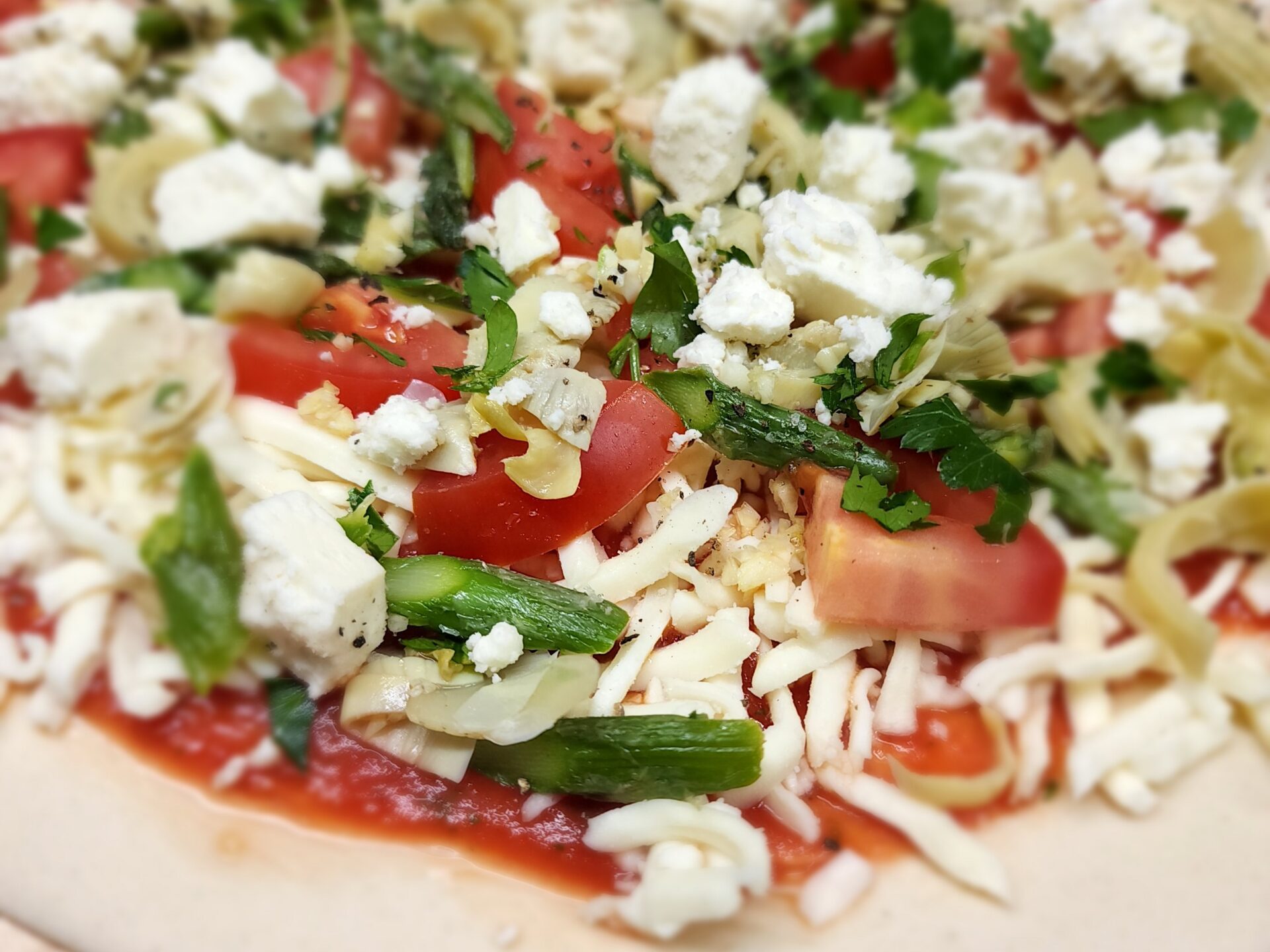 a pizza sitting on top of a plate of food