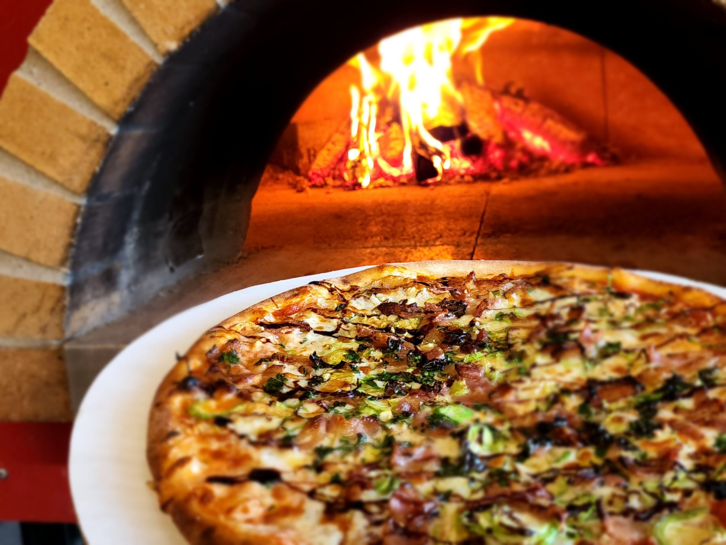 a pizza sitting on top of a pan